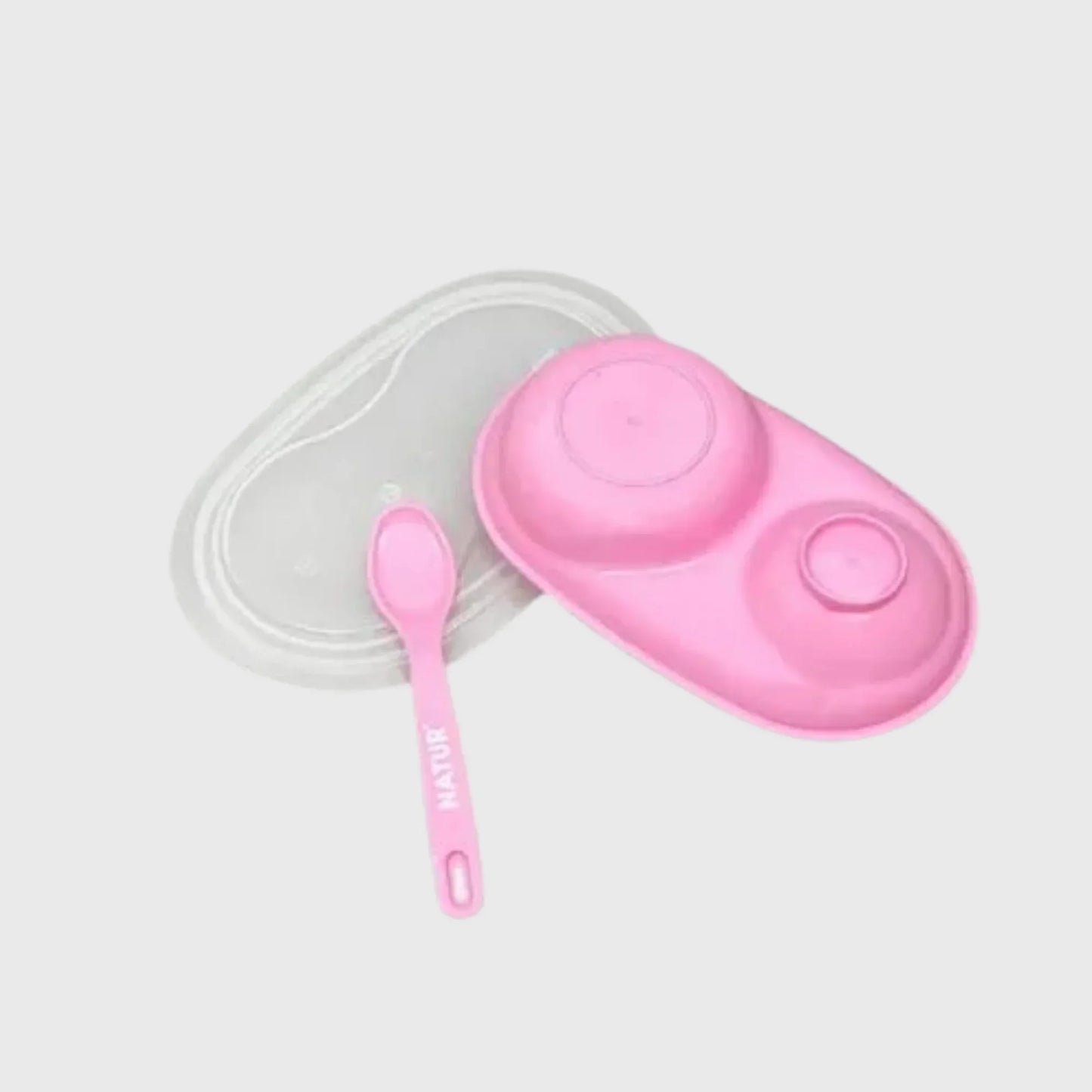 Pink baby feeding set with divided plate, matching spoon, and clear lid on white background