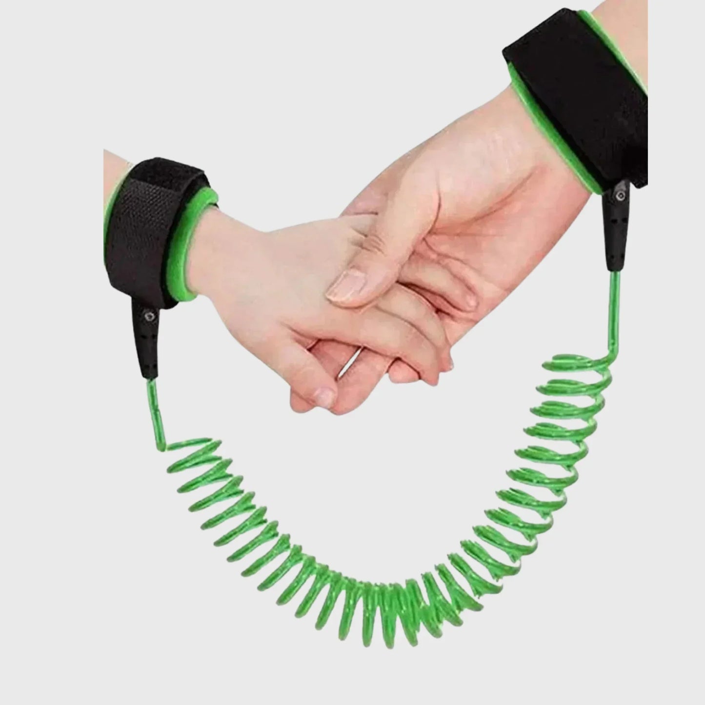 Child safety wrist leash with green coiled cord connecting adult and child wrists