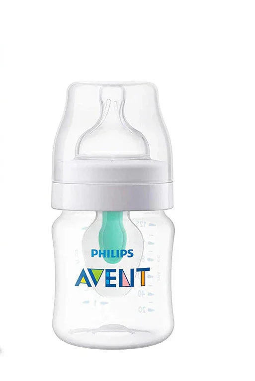 Clear plastic baby feeding bottle with white cap, secure nipple, and measurement markings.