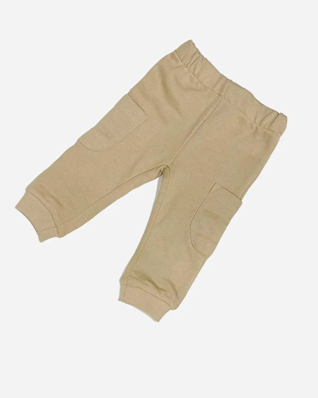 Beige cotton baby jogger pants with side pockets, elastic waistband, and cuffed ankles