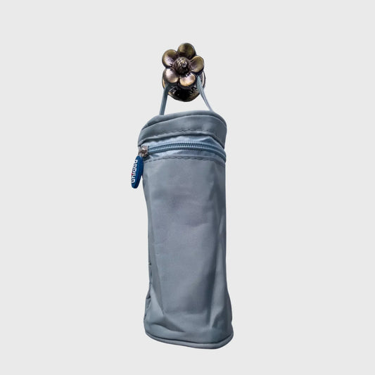 Light blue insulated baby bottle bag with zipper and handle, isolated on white background